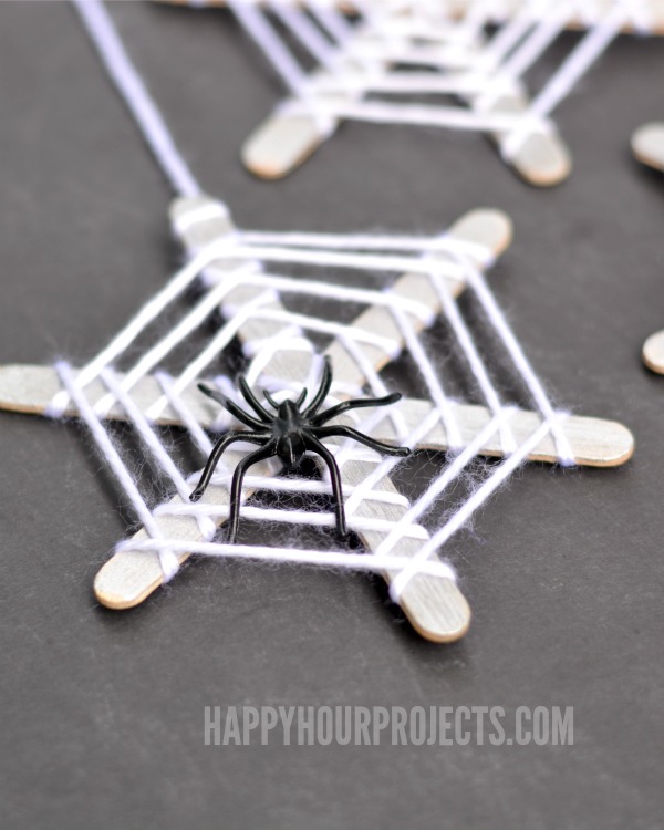 Halloween Crafts for Kids | Craft Stick Spiderwebs at www.happyhourprojects.com