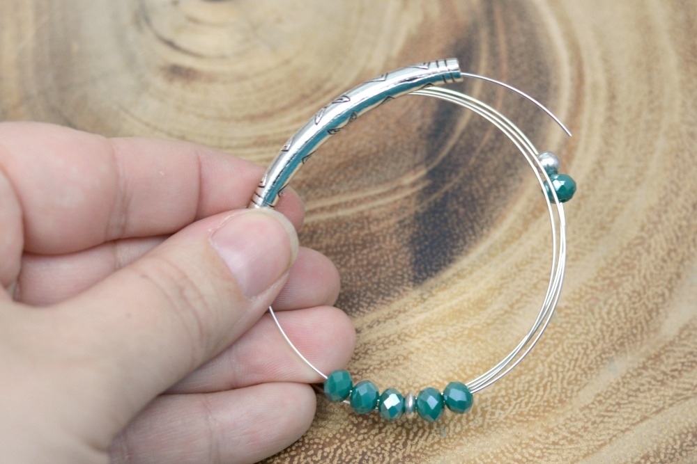Crystal + Tube Bead DIY Memory Wire Bracelet at happyhourprojects.com
